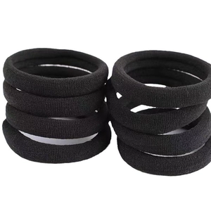 Seamless black elastic hair bands with knit texture on a clean white background