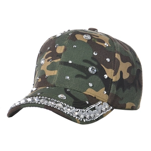 Detail of camouflage baseball cap featuring sparkling rhinestones on the brim and crown
