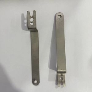 Pair of stainless steel clock hand installation tools with U-shaped forks and holes