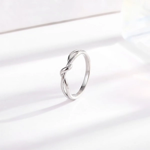 Polished silver infinity knot titanium steel ring for women in minimalist design