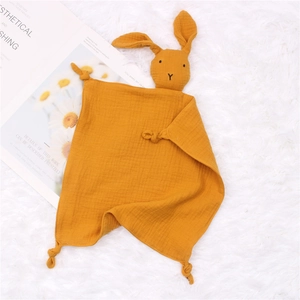 Detail of ginger muslin cotton baby security blanket with a soft rabbit head design