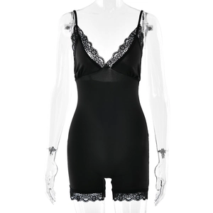 Detail of black lace trim on a sleek bodysuit camisole shown on a transparent mannequin