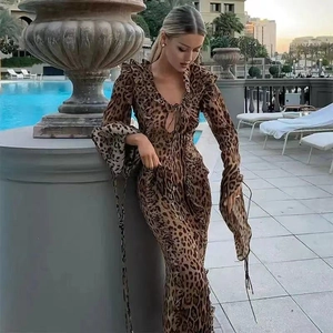Detail of leopard print chiffon maxi dress featuring ruffles and a deep V-neckline