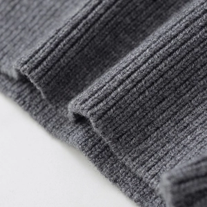 Deep grey loose-fit knit sweater for women featuring a premium ribbed texture design
