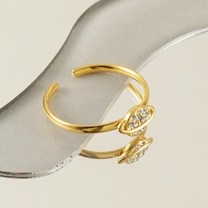 Polished 18k gold planet ring with sparkling crystals and adjustable open band