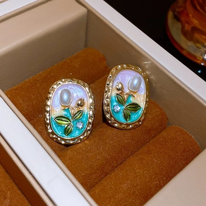 Vintage floral oval earrings with enamel gradient and pearl tulip details in jewelry box