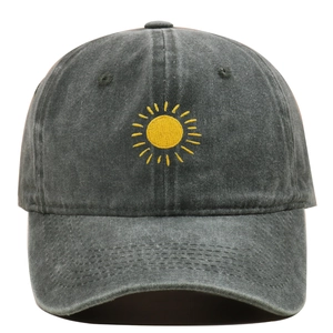 Close-up of yellow sun embroidery on dark gray washed cotton vintage baseball cap