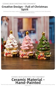 Detail of ceramic bear Christmas tree boxes in white, pink, and green on wood background
