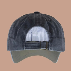 Detail view of washed cotton baseball cap featuring an adjustable bronze metal buckle at back