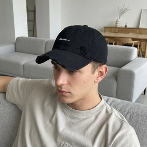 Distressed black cotton baseball cap with Narasen embroidery and ripped vintage details