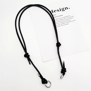 Close-up of black leather strap with silver alloy hook and minimalist adjustable knot
