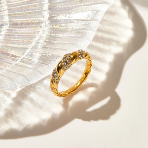 Vintage golden twisted rope ring with pave diamonds in high-polished stainless steel