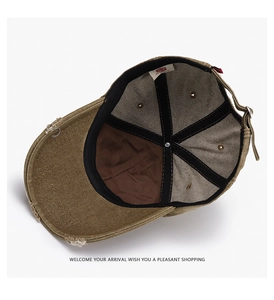 Macro view of distressed khaki baseball cap interior with sweatband and metal buckle
