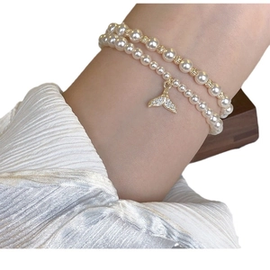 Double-layer pearl bracelet with gold fishtail pendant and zircon accents for women