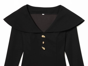 Detail of V-neck collar with golden irregular buttons on black fitted top garment