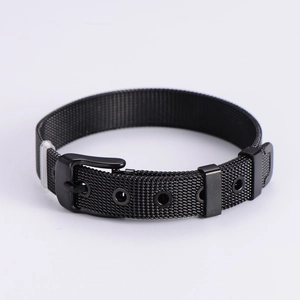 Detail of black Milanese mesh watch strap with adjustable pin buckle and matte finish