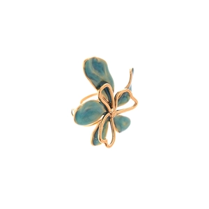 Elegant vintage gold flower ring with blue enamel detail on a clean white background