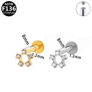 Detail of F136 titanium labret studs with star shape zircon and internal thread structure