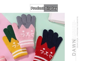 Close-up of knit cat pattern and striped cuffs on colorful winter gloves for children