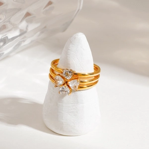 Three-piece gold-plated stainless steel ring set featuring a zircon four-leaf clover design
