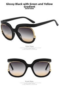 Detail view of large frame sunglasses with black frames and gold line accents