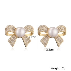 Exquisite 18K gold plated bow earrings with white pearls and sparkling cubic zirconia stones
