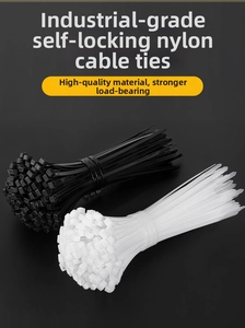 Detail of industrial self-locking nylon cable ties in black and white colors