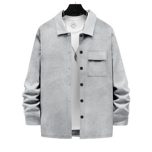 Detail of grey twill jacket with black buttons and a utility pocket over white T-shirt