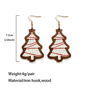 Christmas tree shaped wooden earrings with buffalo plaid pattern and white graphics