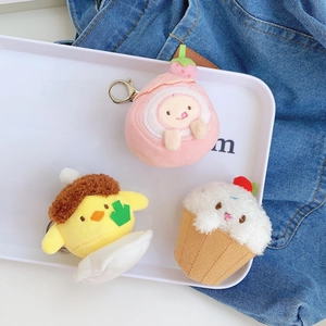 Three cute plush strawberry cream cheese keychains with metal clips on white tray