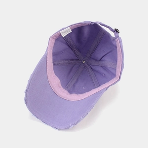 Vintage purple washed cotton baseball cap with distressed brim and adjustable strap back