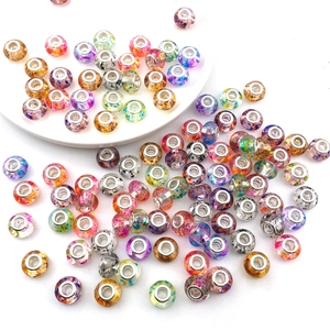 Macro detail of assorted colorful glass and resin large hole beads for DIY bracelets