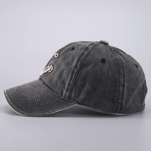 Side view detail of washed cotton baseball cap with anchor embroidery and curved brim