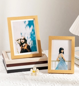 Close-up of minimalist wooden frames in various colors with textured grain finish