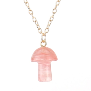 Detailed close-up of a 2cm pink crystal mushroom pendant with a thin gold chain