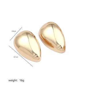 Detailed view of large gold teardrop earrings measuring 4.1cm by 2.6cm and weighing 16g