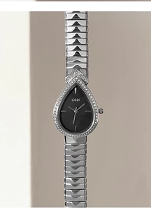 Detail of luxury water-drop quartz watch with rhinestone bezel and V-shaped silver band