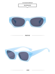 Detailed view of light blue translucent geometric cat-eye sunglasses with dark grey lenses