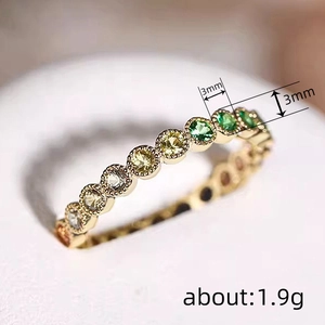 Gold eternity ring with 3mm gradient zircon stones in white, yellow and green tones