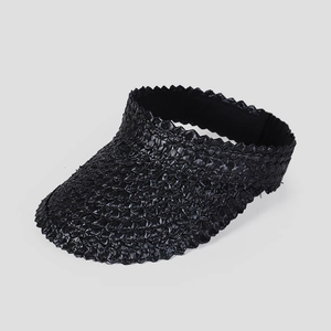 Close-up of black straw sun visor with unique zigzag weave pattern and elastic band