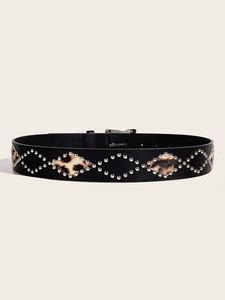 Detail of black leather belt with silver studs and leopard print insets and buckle