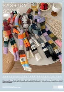 Detail of colorful knitted striped scarves with brand label on a cozy winter table