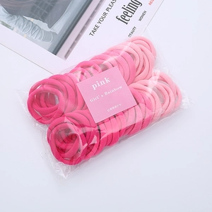 Detailed set of pink elastic hair ties in gradient shades with soft towel texture