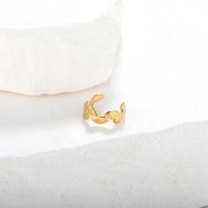 Minimalist gold leaf-shaped ear cuff on stone, non-pierced geometric clip earring