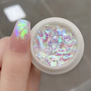 Macro shot of iridescent purple opal nail powder with high-shine aurora glitter finish
