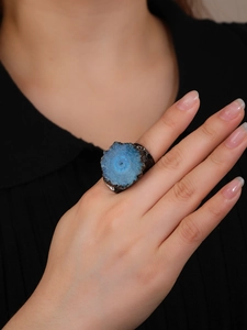 Vintage bronze plated adjustable wide ring featuring a raw blue sunstone crystal