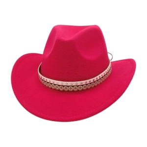 Detailed view of magenta felt western cowboy hat with star pattern decorative band