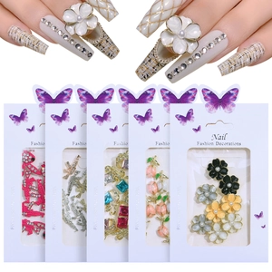 Detail view of multi-style nail charms featuring tulip and bunny shapes on packaging
