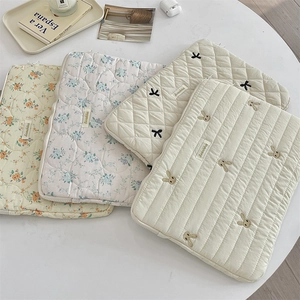Quilted cotton laptop sleeves in floral and striped patterns with cute rabbit embroidery