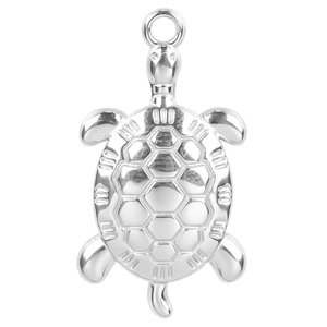 Macro shot of a silver stainless steel sea turtle pendant with a high-polished finish